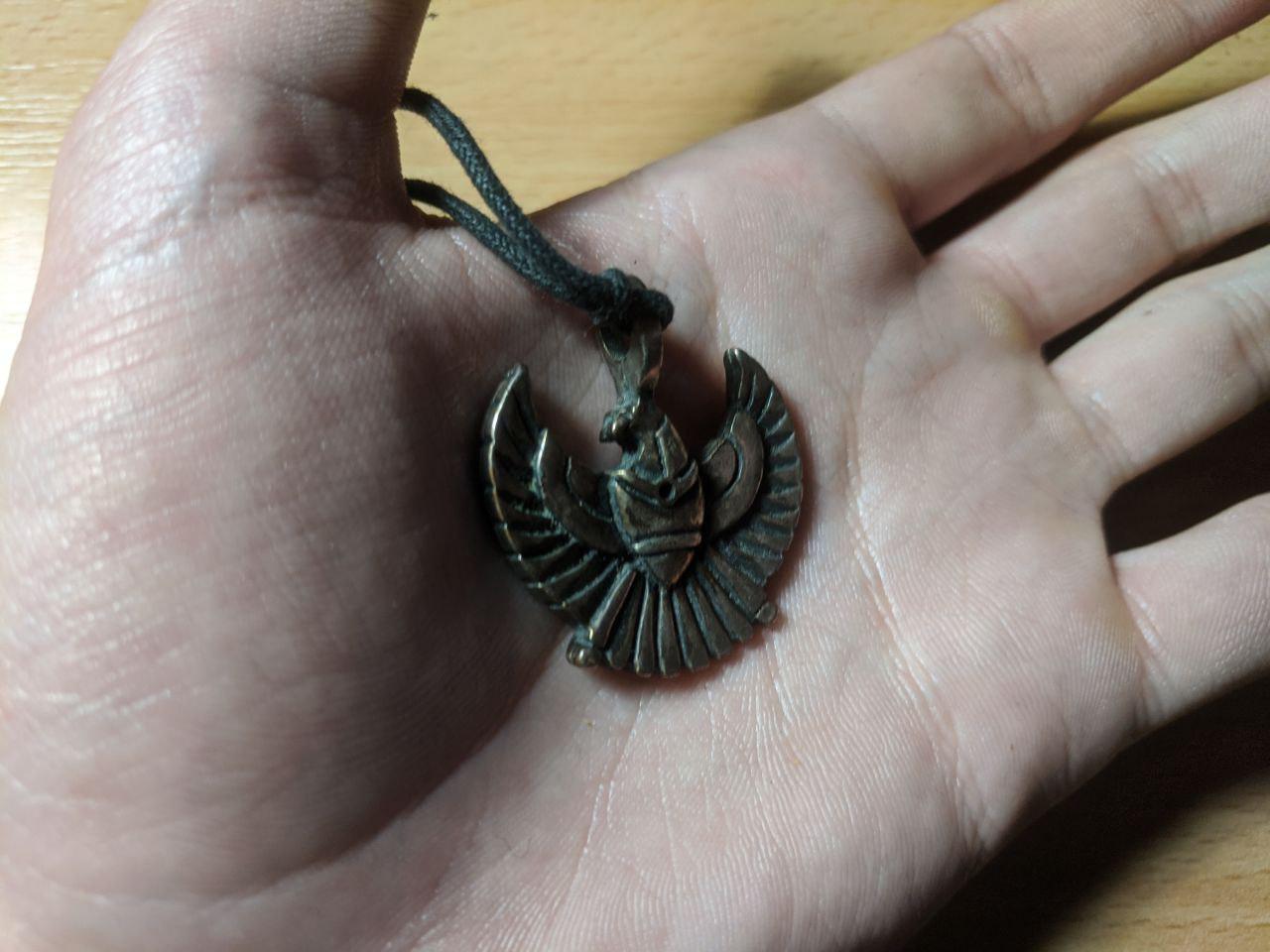 A necklace with a phoenix.